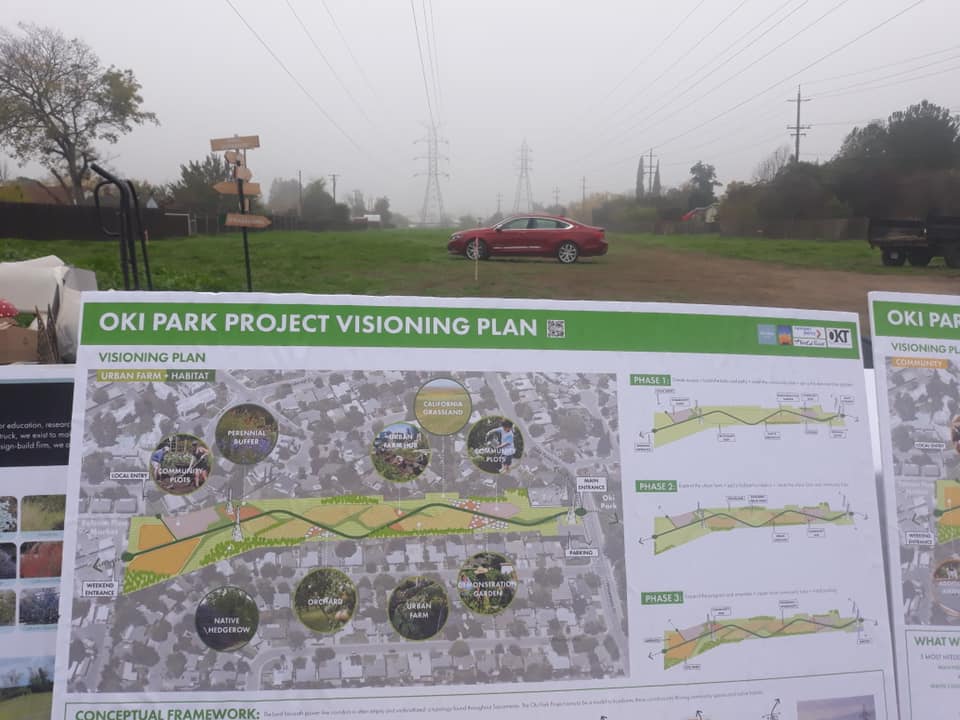 An empty lot next to pictures of NCR's urban farm vision.