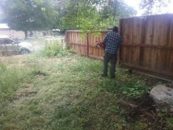 A volunteer provides yard work assistance. 